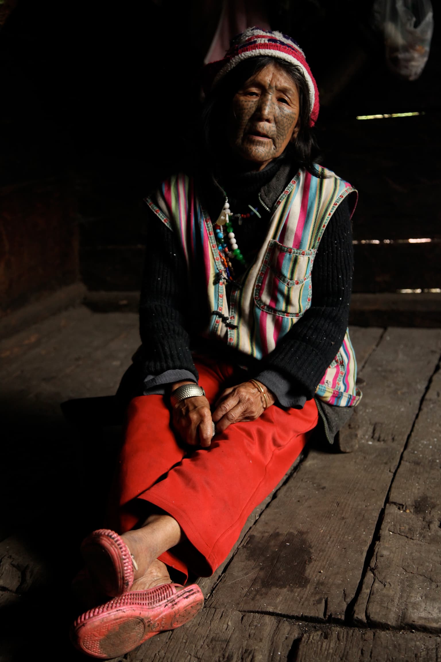 Drung Valley, Yunnan Province, Southwest China. 2012
Located at the foothills of the Himalaya mountains on the border of Northern Myanmar and Northwestern Yunnan province in Southwestern China, the Drung Valley is one of the wildest and most remote valleys in China. This region has been classified by UNESCO as a Biosphere Reserve as well as a World Heritage Site, and is home to a rich biosphere, rare indigenous species of plants and animals. The Drung minority has a total population of approximately 6000 individuals. Drung women born before 1949 have their entire face tattooed. I was told by my host that this practice, which was banned by Mao Zedong in 1949, aimed to protect women from other tribes. There were 18 of these women still alive when I visited the mountain village in 2012. They are considered national treasures by the Chinese government. A road was built to access the valley in 1998, and until the building of a new highway in 2014, the valley was closed off for part of the year during the winter season. During my travels to the Drung valley in 2012, I was told by my host that about 50 foreigners a year had travelled to the valley since 2009.